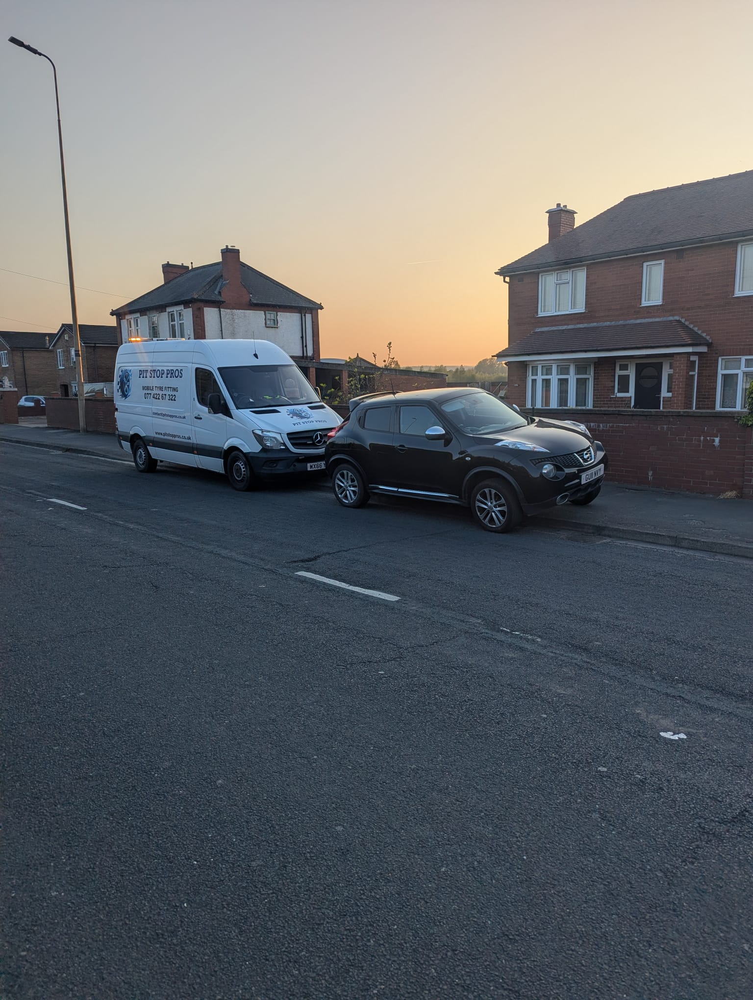 Pit Stop Pros service van assisting a client at sunset
