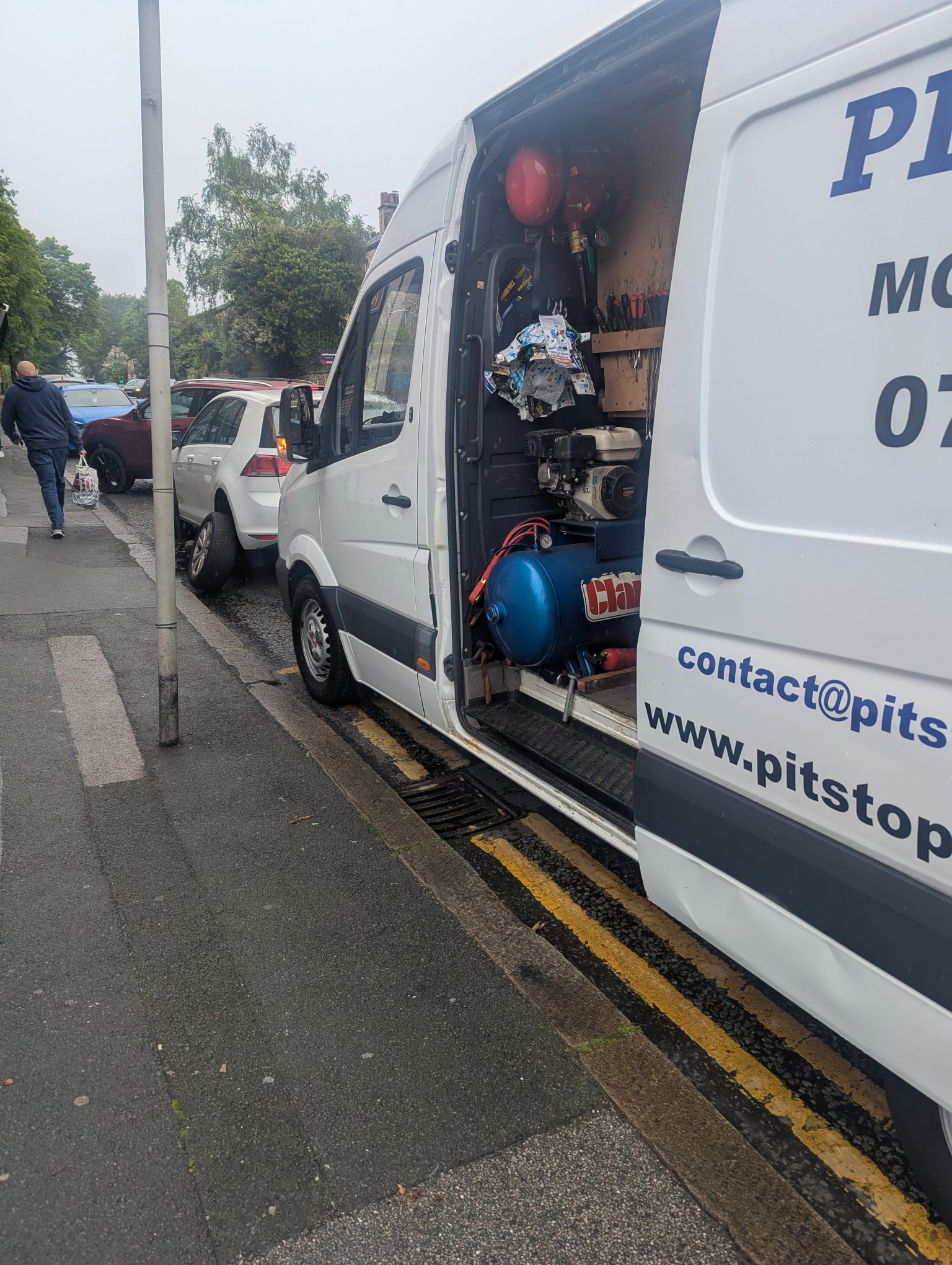 Inside look of Pit Stop Pros mobile van workspace with machinery