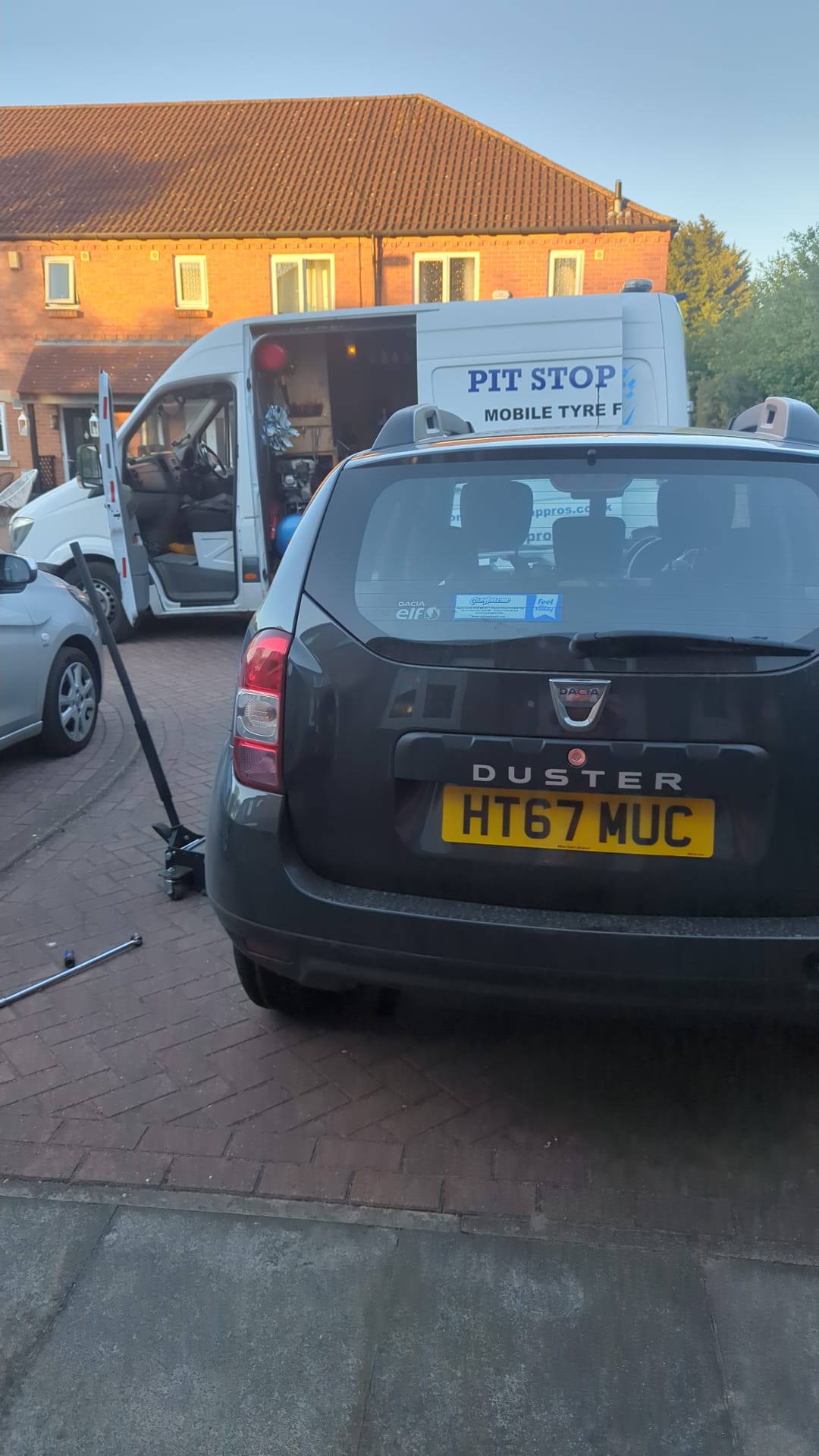 Close up view of the open side door of the tyre van and tools